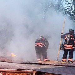 Firefighters work to extinguish the blaze on May 3 at 79 Meadlock Pennell Drive in the Ellendale Community.