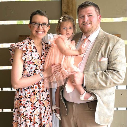INGLE FAMILY — Chelsey Ingle is fighting cervical cancer. A fundraising event is planned July 26 at Alexander Central High School. She is shown above with her husband, Tanner, and their daughter, Stella.